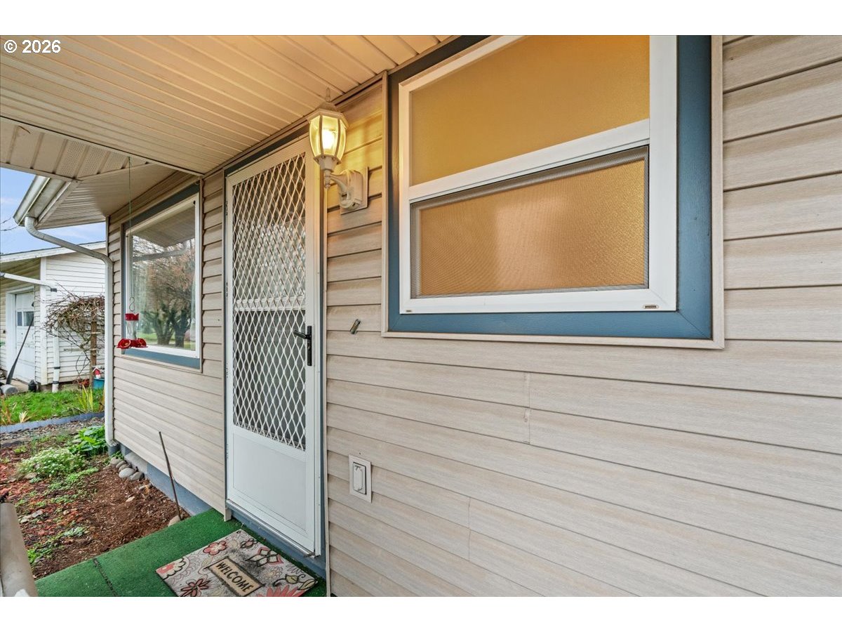 1386 Umpqua Road Woodburn, OR 97071 - Photo 4 of 32 a view of a house with a window