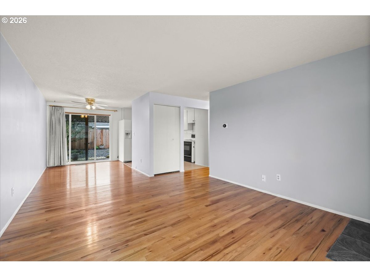 1386 Umpqua Road Woodburn, OR 97071 - Photo 8 of 32 a view of an empty room and wooden floor