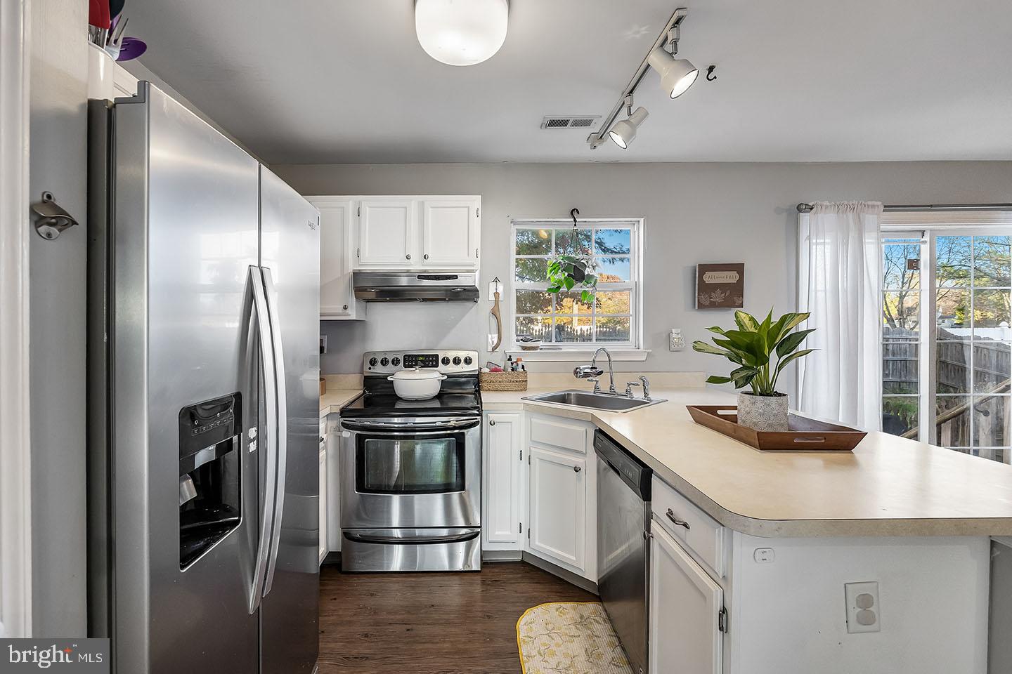 72 Pondview Lane Sicklerville, NJ 08081 - Photo 13 of 34 a kitchen with stainless steel appliances a sink stove and refrigerator