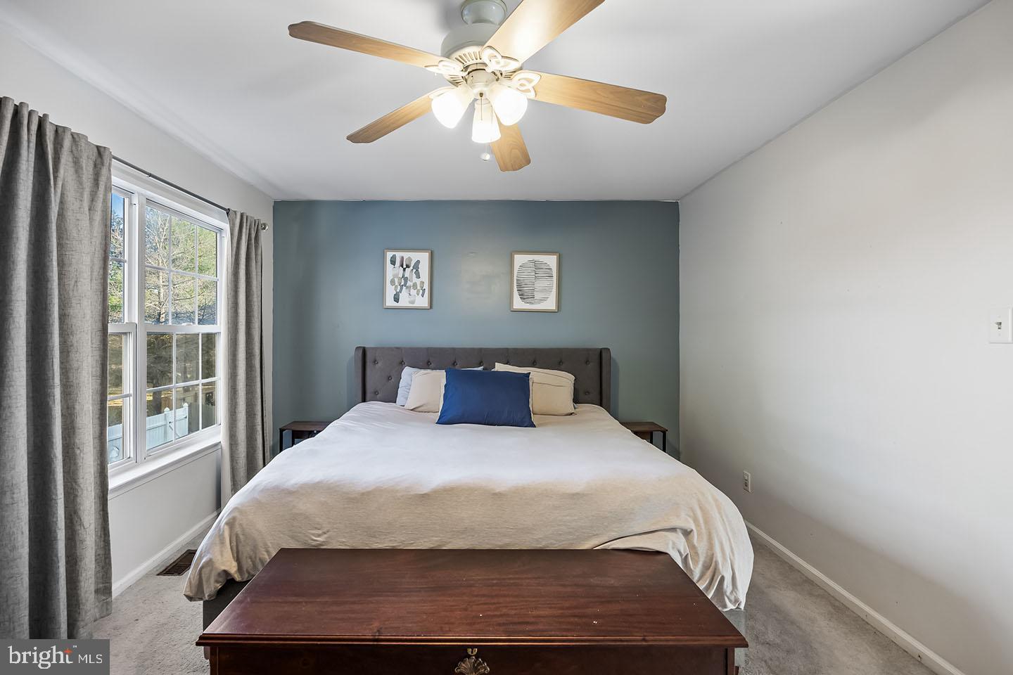 72 Pondview Lane Sicklerville, NJ 08081 - Photo 19 of 34 a bedroom with a large bed and a chandelier