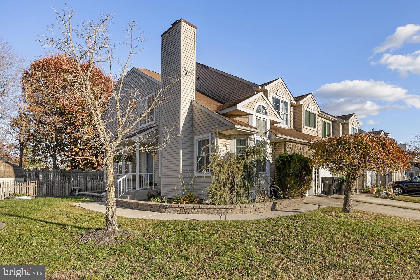 72 Pondview Lane Sicklerville, NJ 08081 - Photo 2 of 34 a front view of a house with a yard