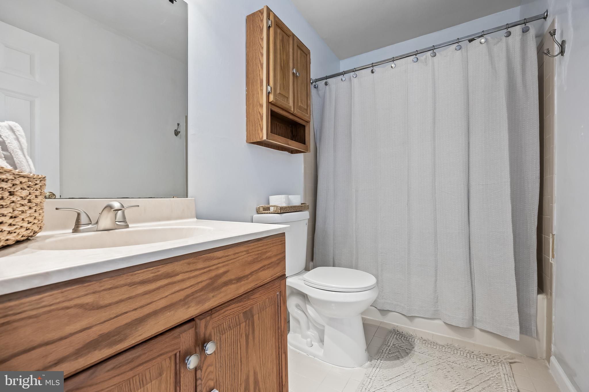 72 Pondview Lane Sicklerville, NJ 08081 - Photo 25 of 34 a bathroom with a sink toilet and shower