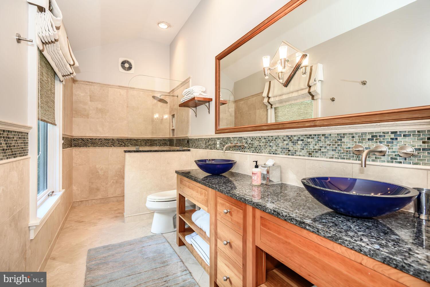 7508 Cooper Point Road Bozman, MD 21612 - Photo 108 of 116 a bathroom with a granite countertop sink and a mirror