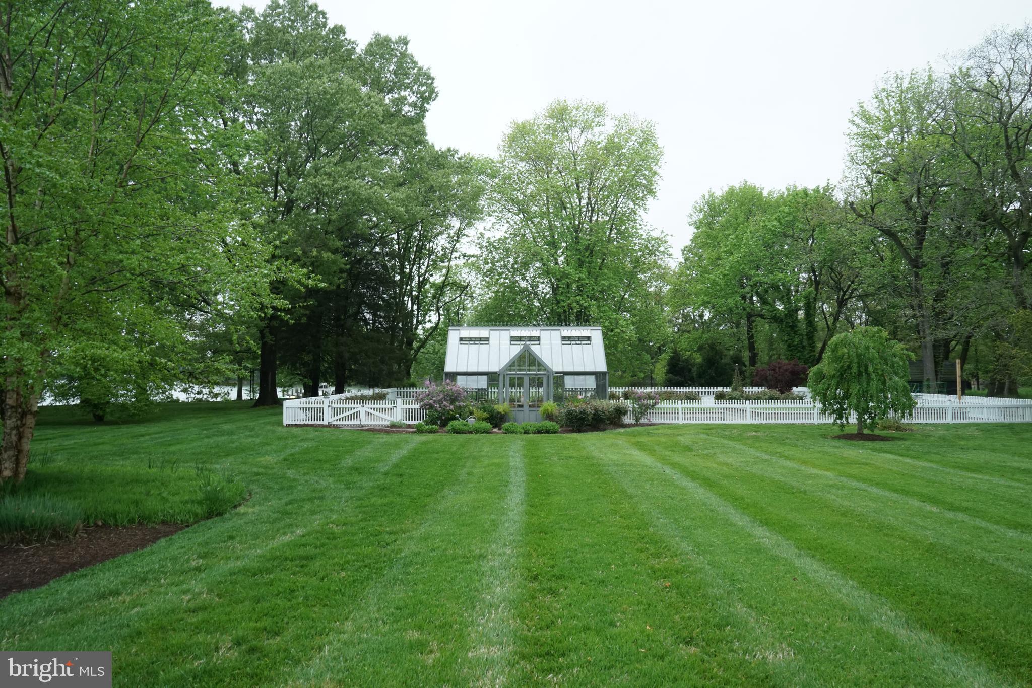 7508 Cooper Point Road Bozman, MD 21612 - Photo 109 of 116 Greenhouse with fenced raised garden beds