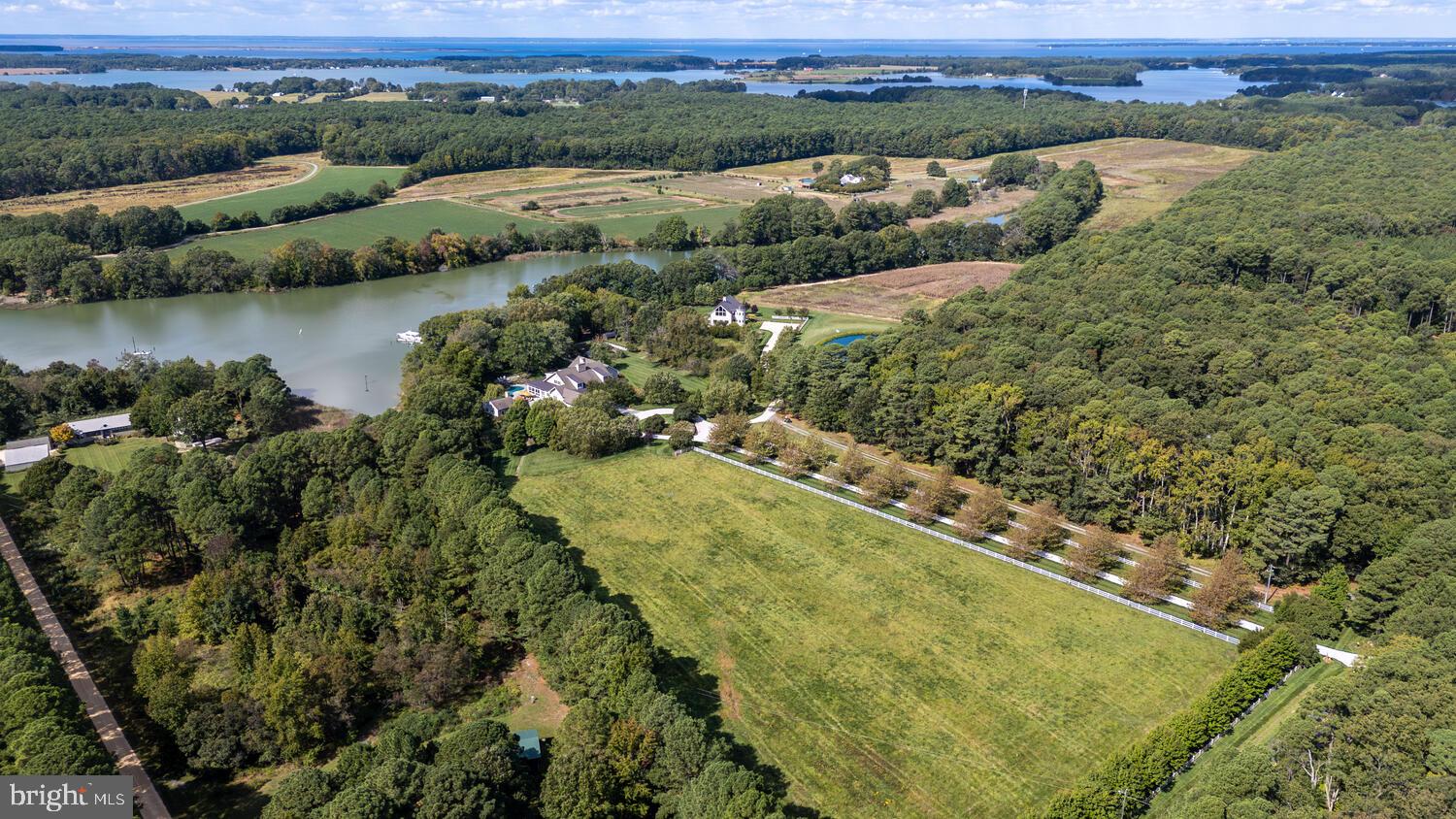 7508 Cooper Point Road Bozman, MD 21612 - Photo 11 of 116 an aerial view of residential houses with outdoor space and river