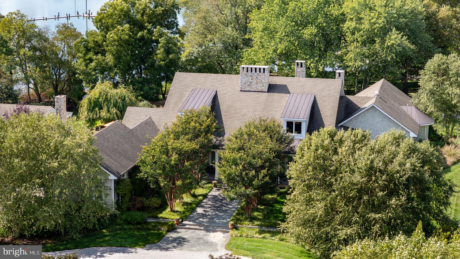 7508 Cooper Point Road Bozman, MD 21612 - Photo 15 of 116 an aerial view of a house with yard and outdoor seating