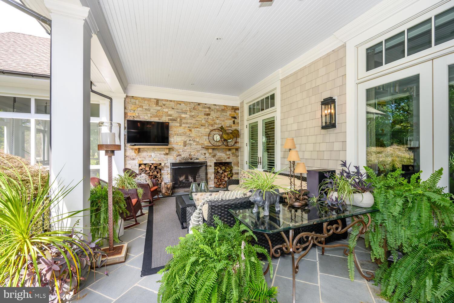 7508 Cooper Point Road Bozman, MD 21612 - Photo 33 of 116 Open porch with wood burning fireplace