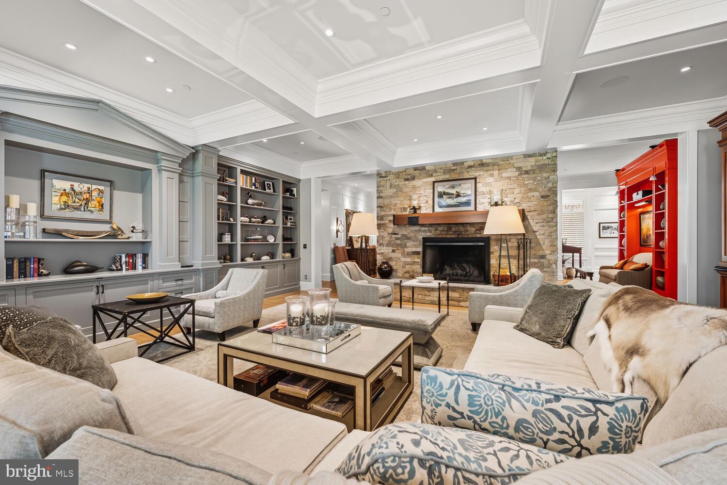 7508 Cooper Point Road Bozman, MD 21612 - Photo 42 of 116 a living room with furniture kitchen view and a fireplace