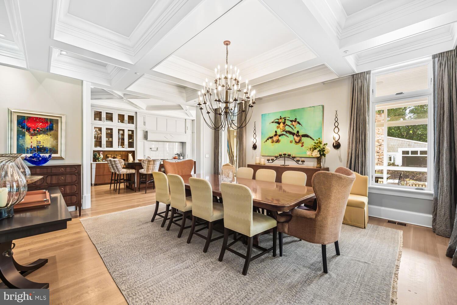 7508 Cooper Point Road Bozman, MD 21612 - Photo 47 of 116 a view of a dining room with furniture a chandelier and wooden floor