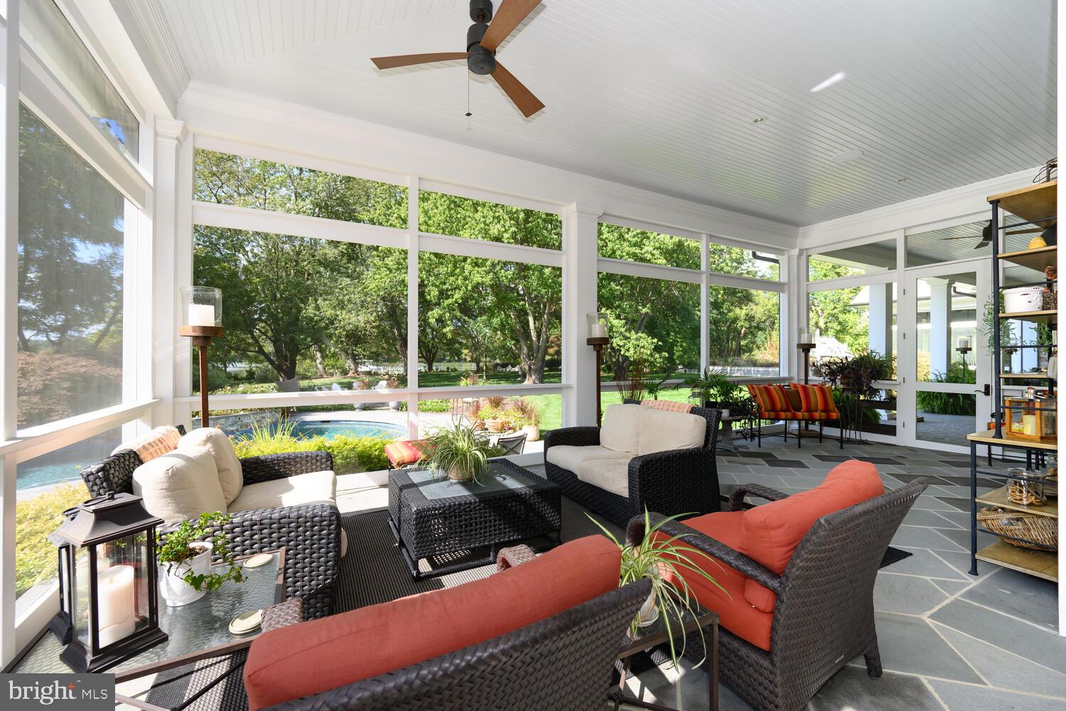 7508 Cooper Point Road Bozman, MD 21612 - Photo 54 of 116 Screen Porch overlooking gunite pool w/ waterfall