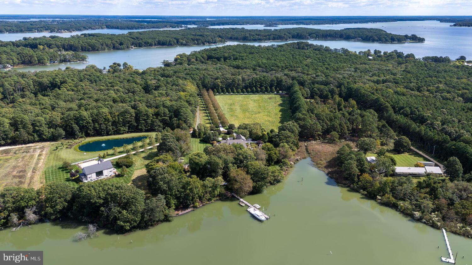 7508 Cooper Point Road Bozman, MD 21612 - Photo 7 of 116 an aerial view of a house with a lake view