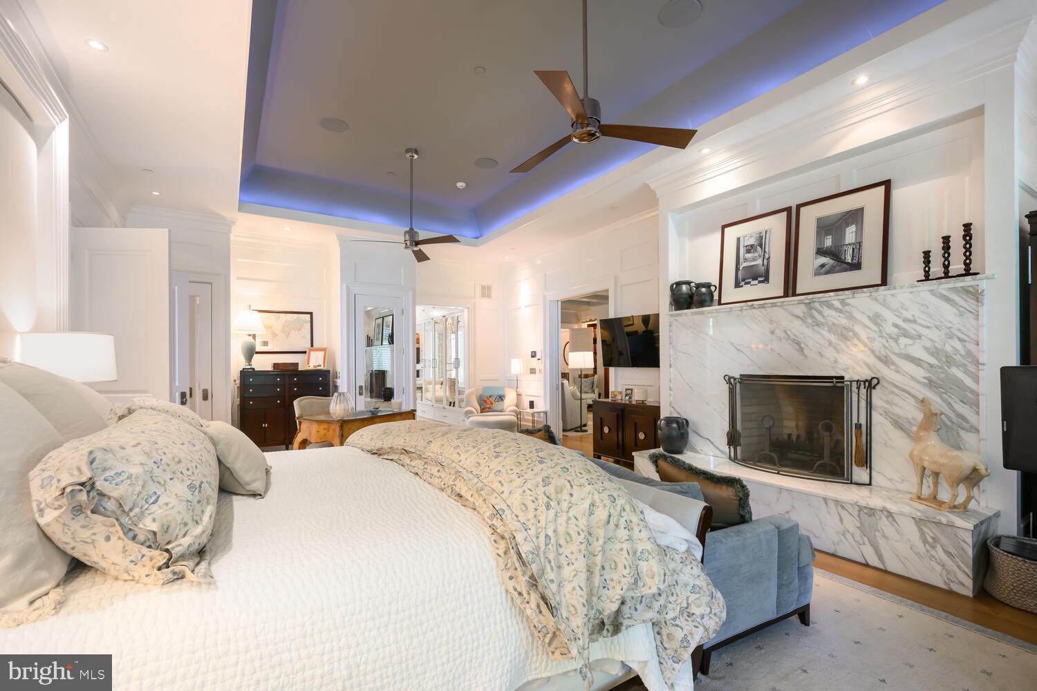 7508 Cooper Point Road Bozman, MD 21612 - Photo 72 of 116 a bedroom with a bed and a fireplace