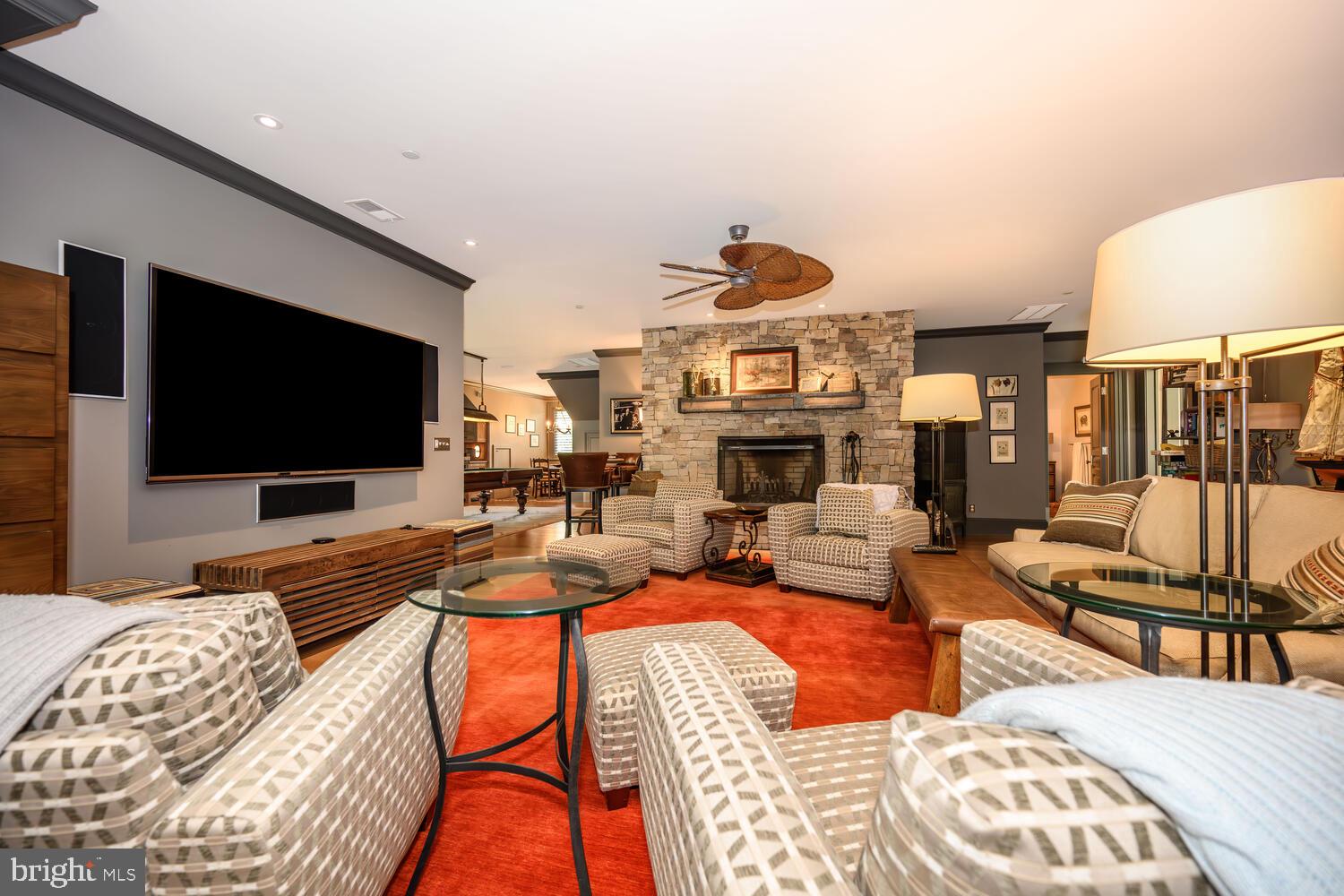 7508 Cooper Point Road Bozman, MD 21612 - Photo 89 of 116 a living room with furniture and a flat screen tv