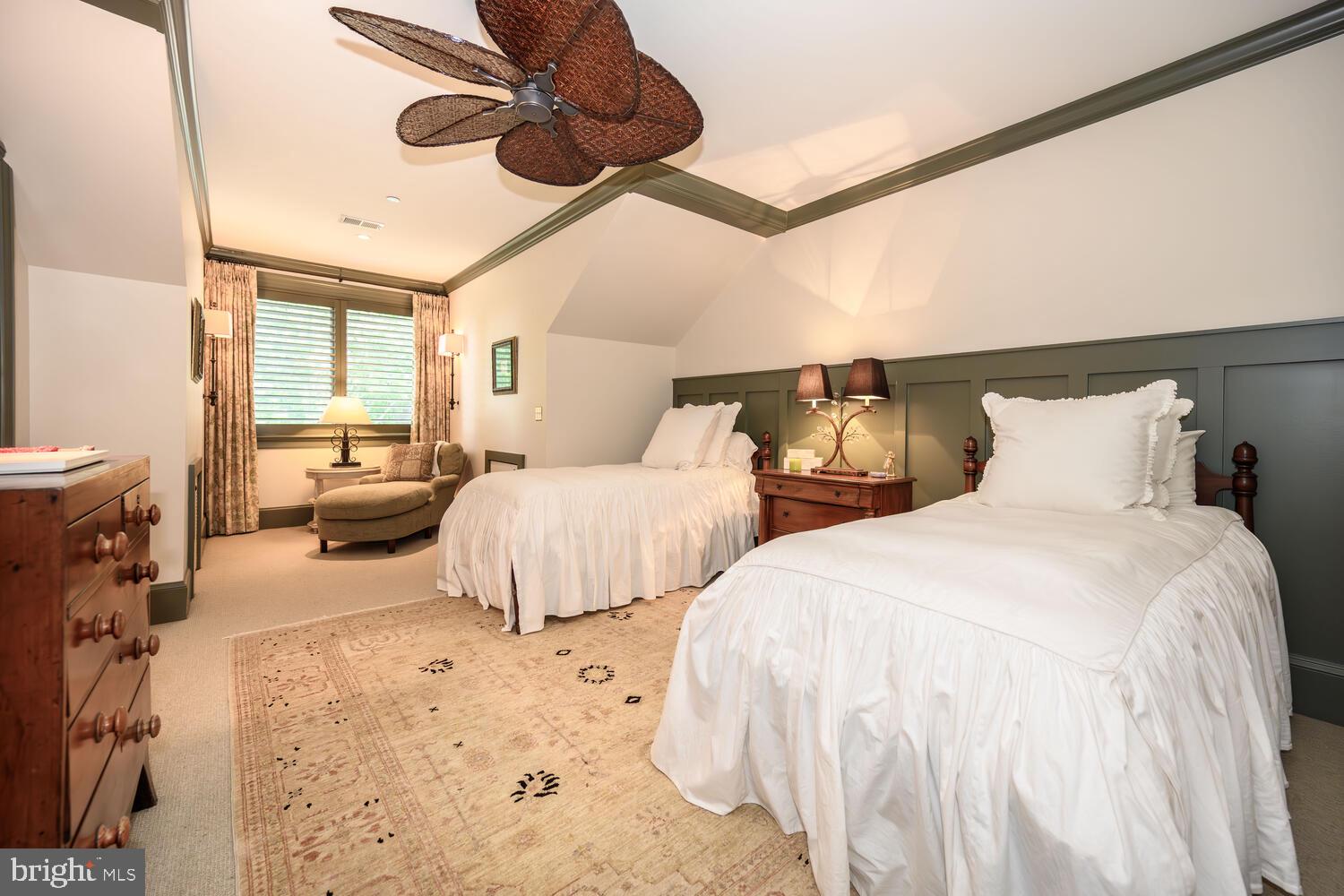 7508 Cooper Point Road Bozman, MD 21612 - Photo 90 of 116 a bedroom with two large bed and a chandelier