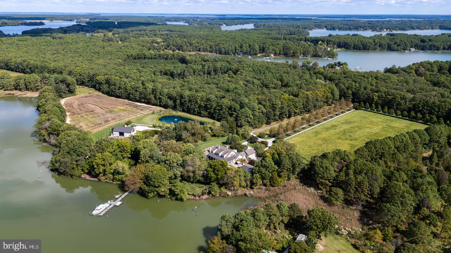 7508 Cooper Point Road Bozman, MD 21612 - Photo 9 of 116 a view of a lake with a mountain in the background