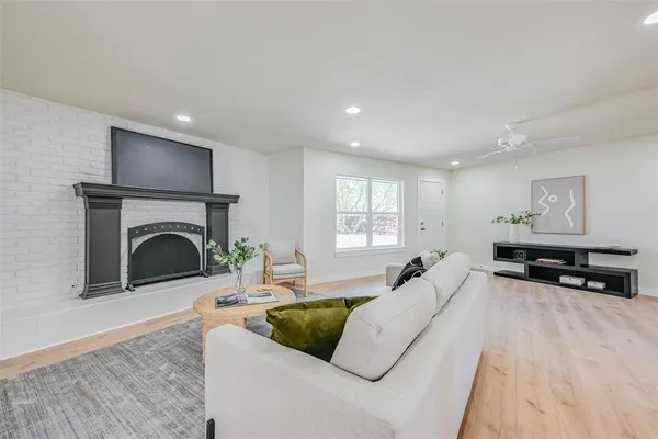 a living room with furniture and a fireplace