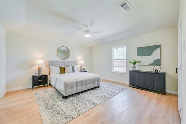 a bedroom with a bed and a dresser