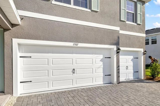 a view of a swimming pool and an outdoor seating