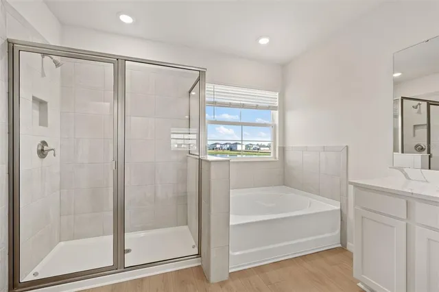 a spacious bathroom with a double vanity sink mirror and