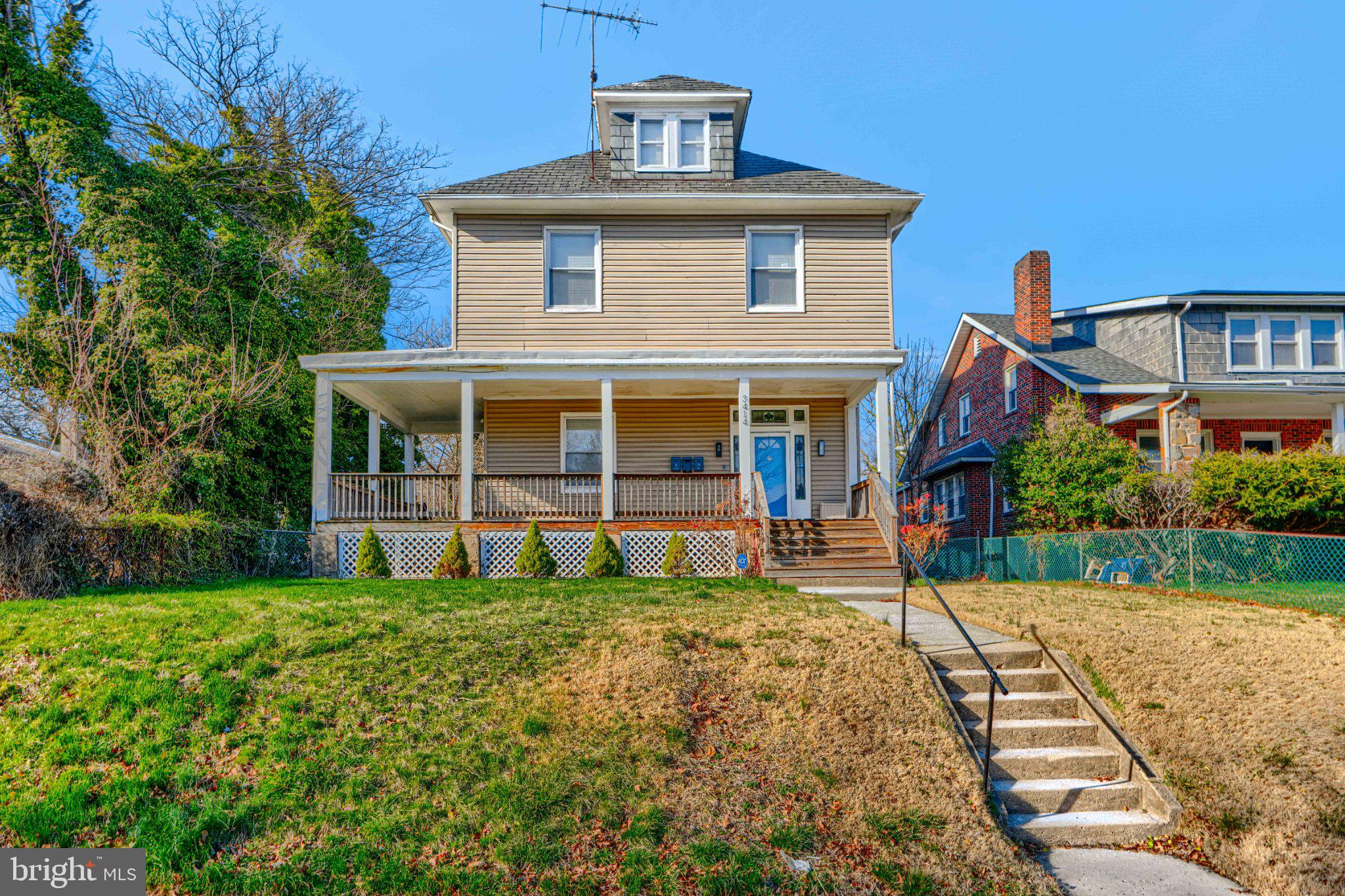 Charming two-story home with porch.