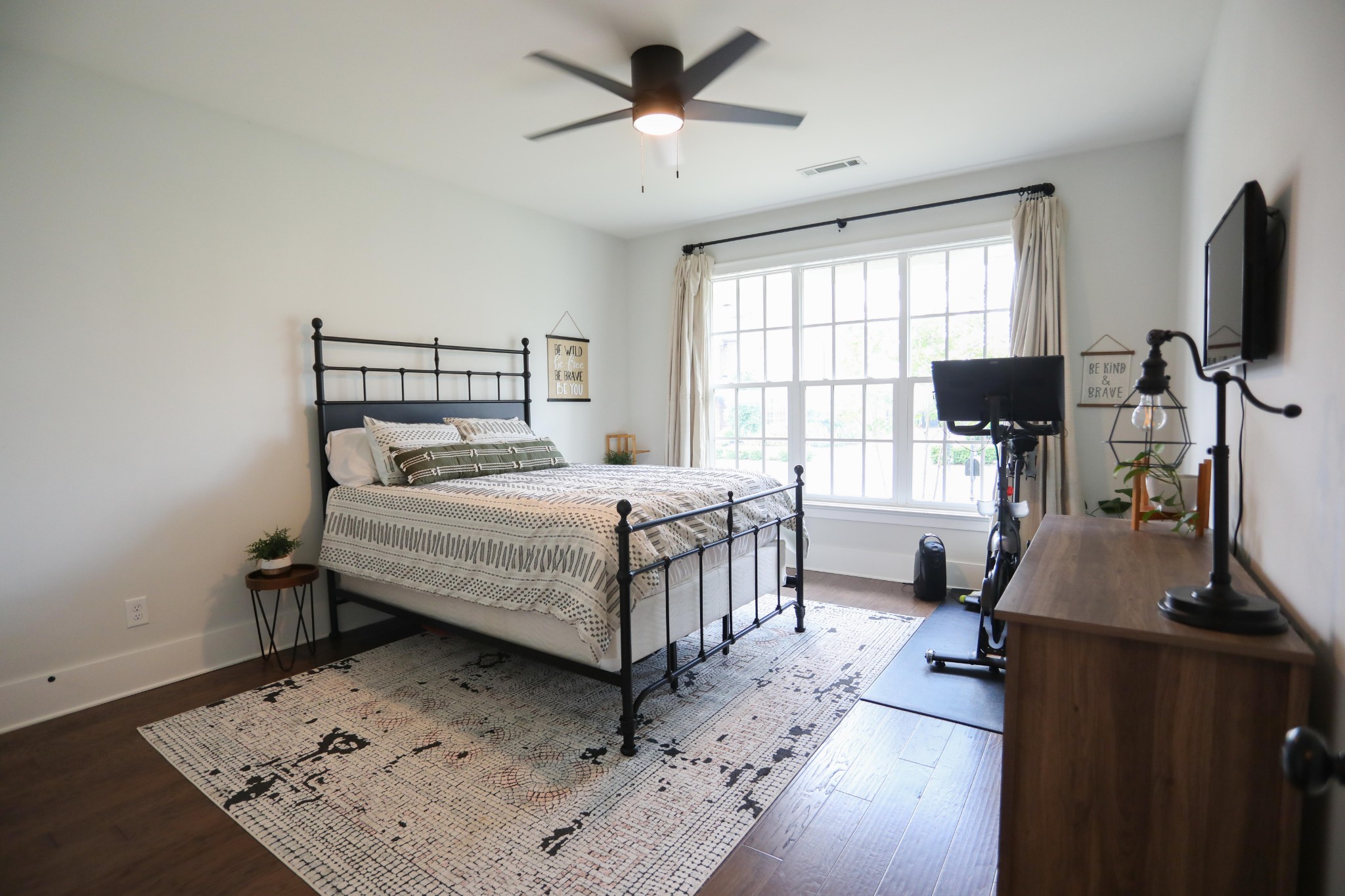 119 Vanner Road Mount Juliet, TN 37122 - Photo 17 of 44 a bedroom with a bed window and a flat screen tv