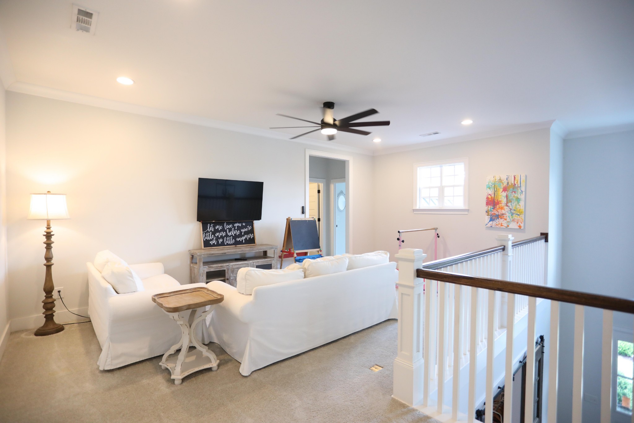119 Vanner Road Mount Juliet, TN 37122 - Photo 26 of 44 a living room with furniture kitchen view and a flat screen tv