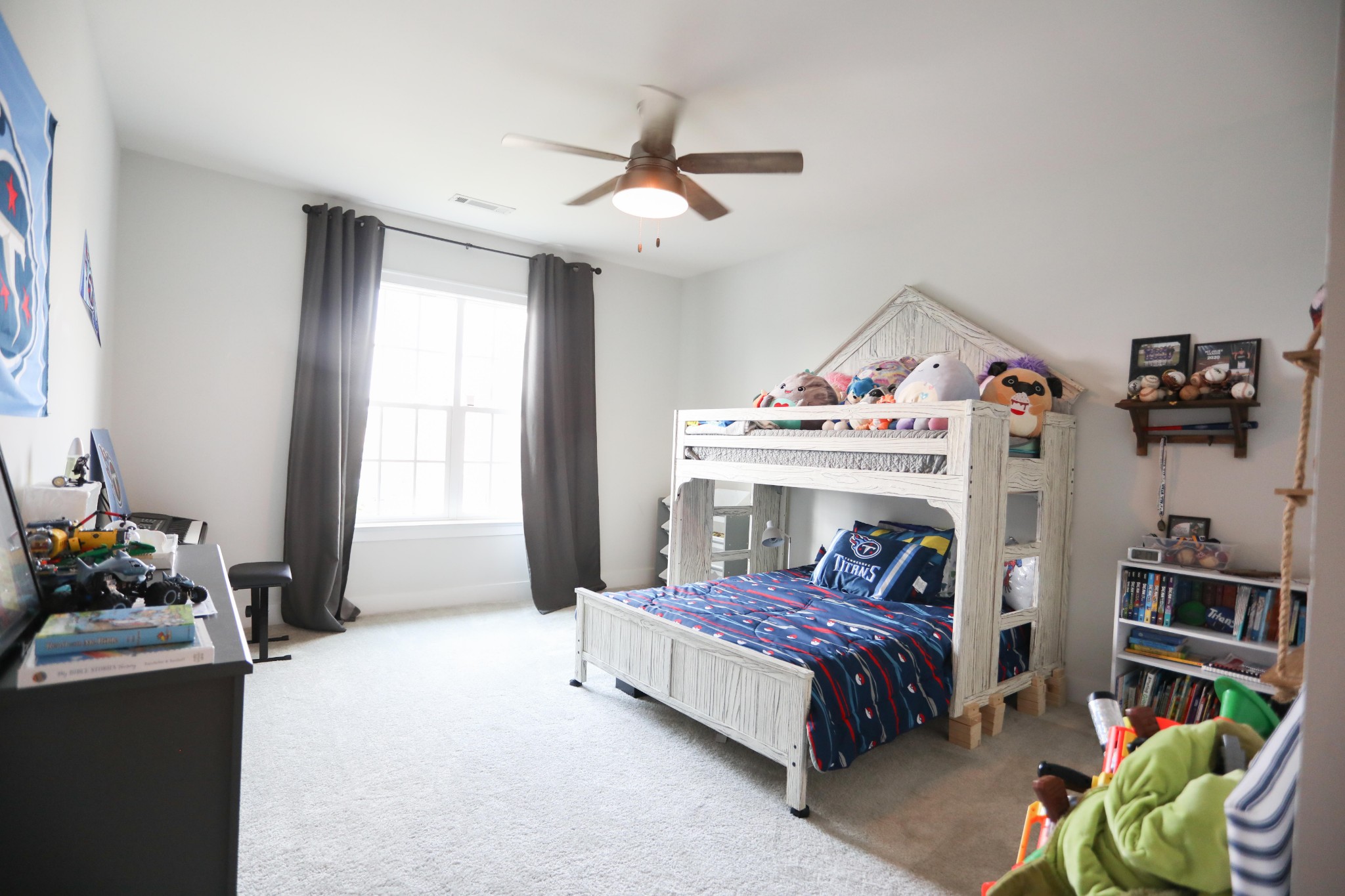 119 Vanner Road Mount Juliet, TN 37122 - Photo 28 of 44 a bedroom with a bed a couch and a window