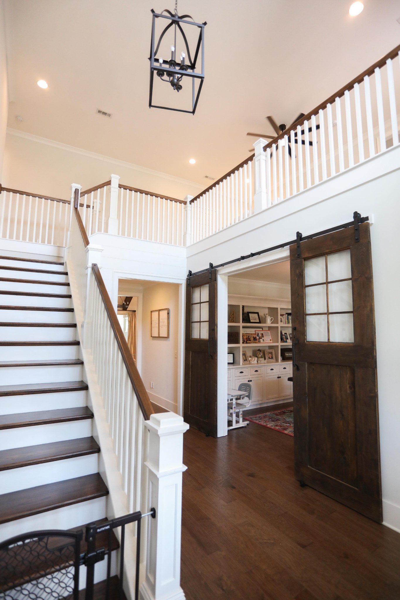 119 Vanner Road Mount Juliet, TN 37122 - Photo 4 of 44 a view of staircase with lots of frames on wall and wooden floor