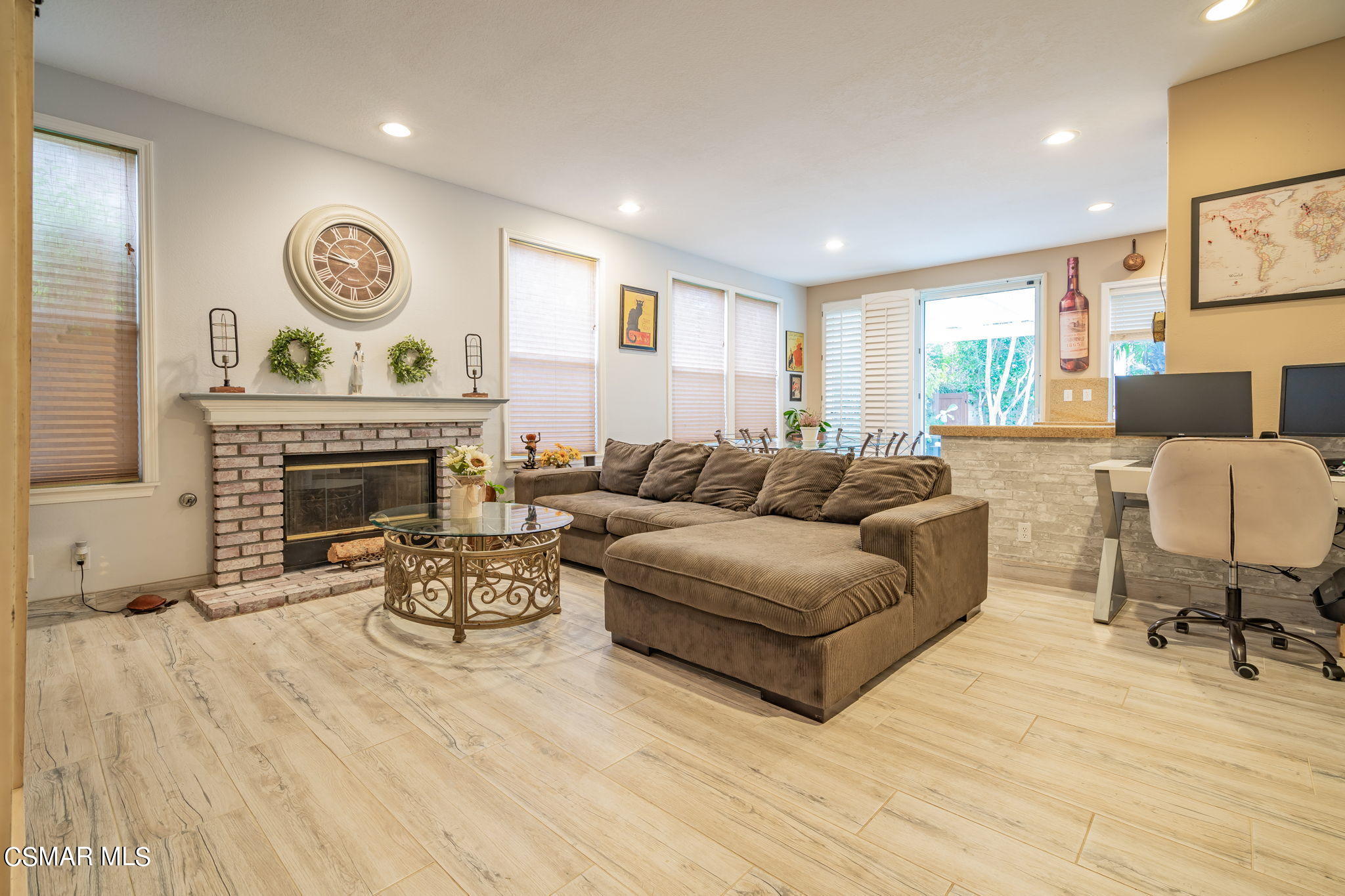 4343 Cedardale Road Moorpark, CA 93021 - Photo 22 of 73 a living room with furniture a fireplace and a table