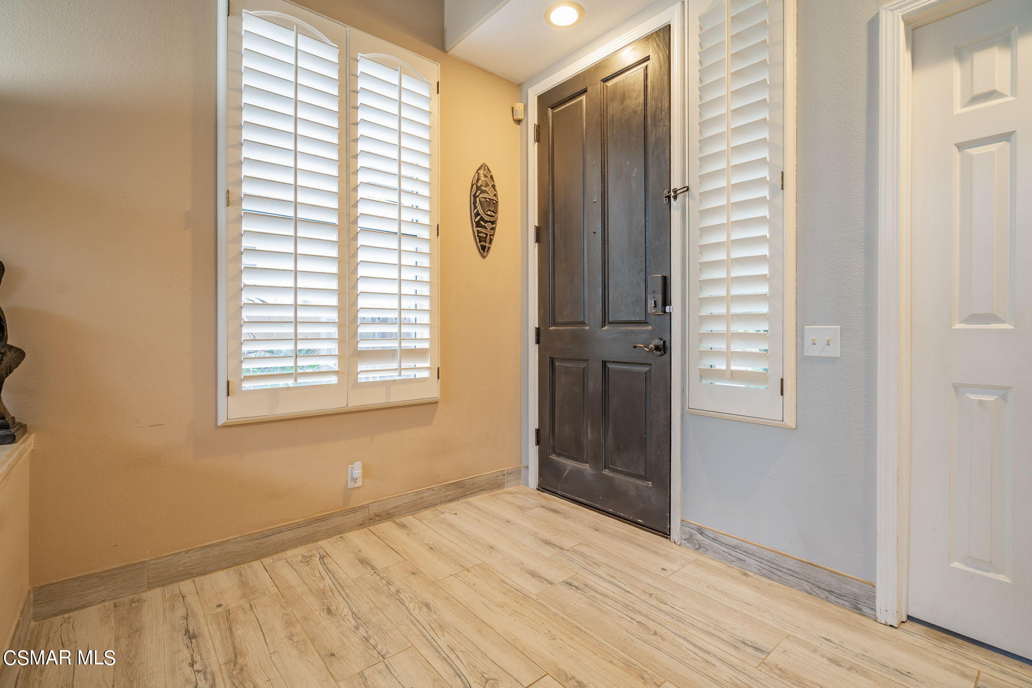 4343 Cedardale Road Moorpark, CA 93021 - Photo 8 of 73 a view of an empty room with wooden floor and a window