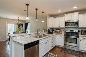 218 Wainwright Drive Crestview, FL 32539 - Photo 11 of 42 a kitchen with a sink stove and microwave