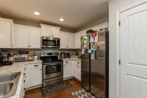 218 Wainwright Drive Crestview, FL 32539 - Photo 12 of 42 a kitchen with a sink stainless steel appliances and cabinets