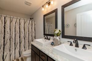 218 Wainwright Drive Crestview, FL 32539 - Photo 26 of 42 a bathroom with double vanity sink and a mirror