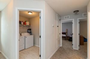 218 Wainwright Drive Crestview, FL 32539 - Photo 28 of 42 a view of a hallway to closet and a living room