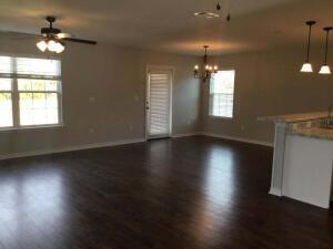218 Wainwright Drive Crestview, FL 32539 - Photo 39 of 42 an empty room with wooden floor and windows