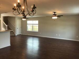 218 Wainwright Drive Crestview, FL 32539 - Photo 40 of 42 a view of a room with wooden floor and chandelier