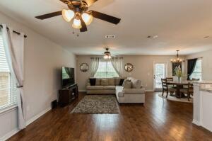 218 Wainwright Drive Crestview, FL 32539 - Photo 4 of 42 a living room with furniture and a flat screen tv