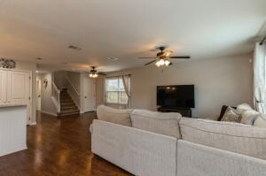218 Wainwright Drive Crestview, FL 32539 - Photo 6 of 42 a living room with furniture and a flat screen tv