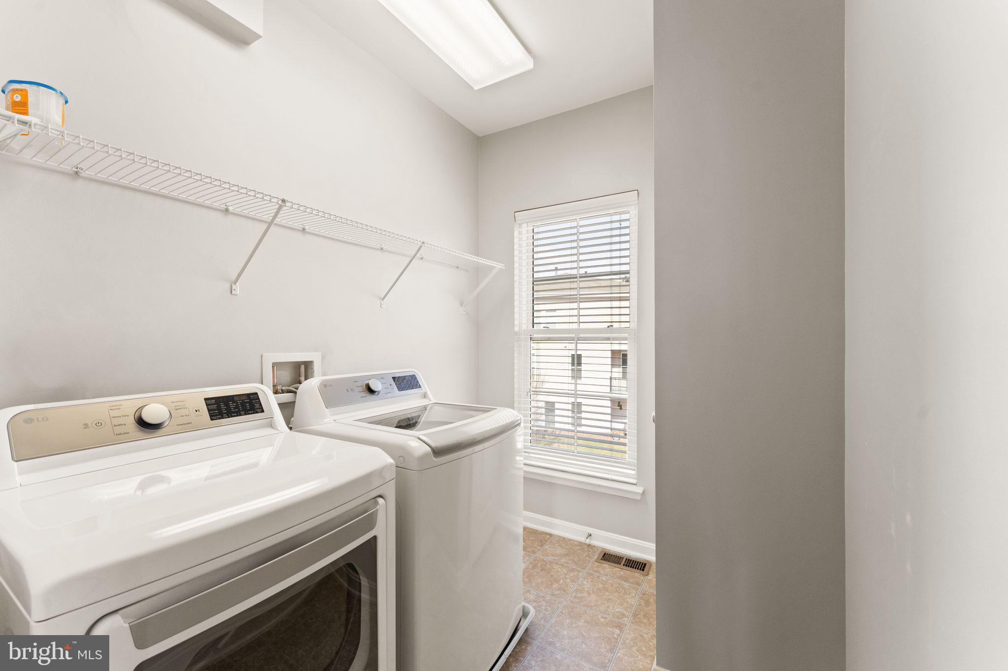 42295 Riggins Ridge Terrace Brambleton, VA 20148 - Photo 52 of 69 Laundry room with upgraded washer & dryer