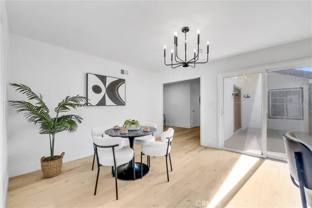 a kitchen with stainless steel appliances granite countertop a stove a sink a refrigerator and a granite counter tops