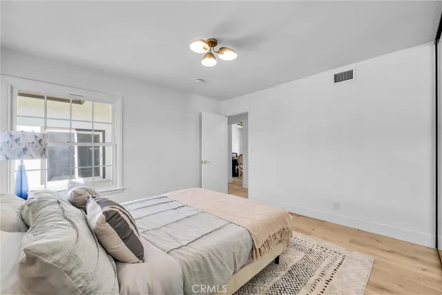 a room with a white furniture and window