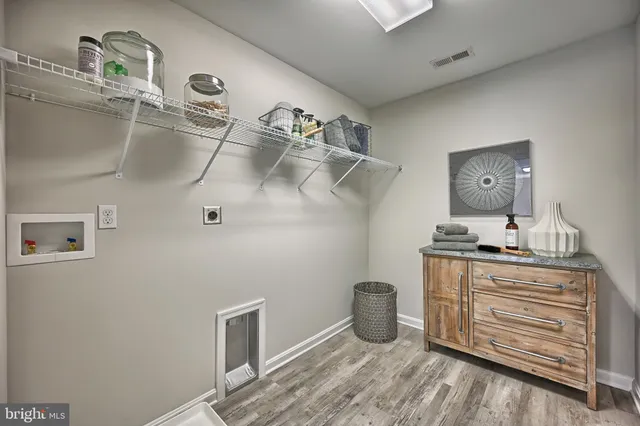 a kitchen with a refrigerator and cabinets