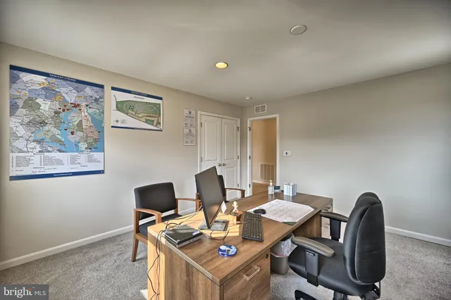 a view of a workspace with furniture