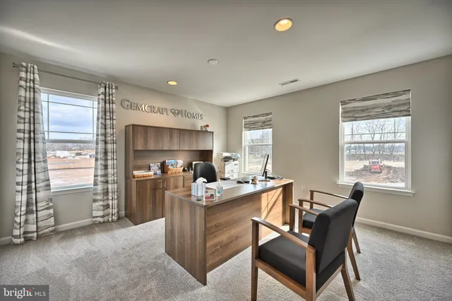 a dining room with furniture and a window