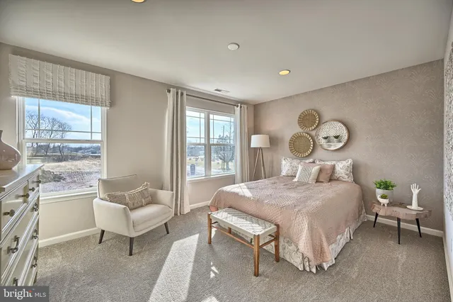 a bedroom with a bed and a lamp with window