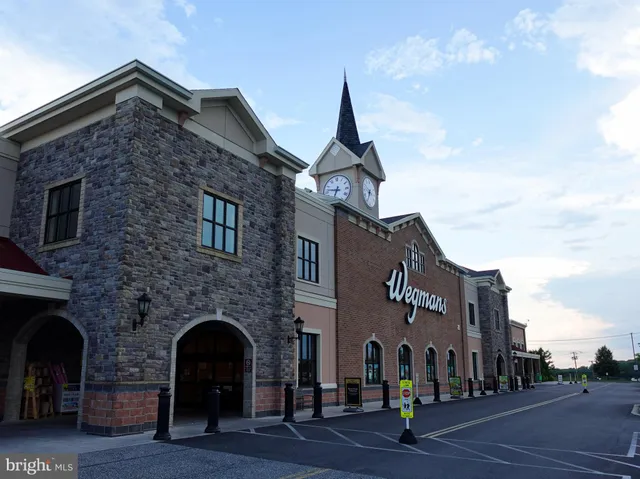 a group of people sitting in front of building