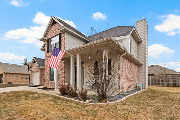a view of a house with a house and a yard