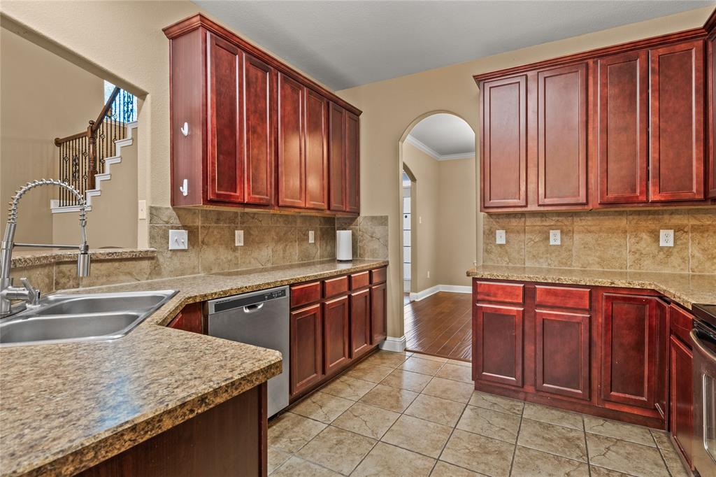 517 Austin Acre Road Sulphur Springs, TX 75482 - Photo 11 of 36 a kitchen with stainless steel appliances granite countertop a sink dishwasher stove and cabinets