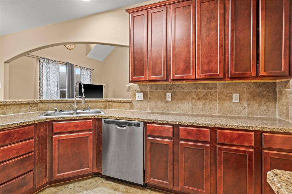 517 Austin Acre Road Sulphur Springs, TX 75482 - Photo 12 of 36 a kitchen with stainless steel appliances granite countertop wooden cabinets a sink and dishwasher