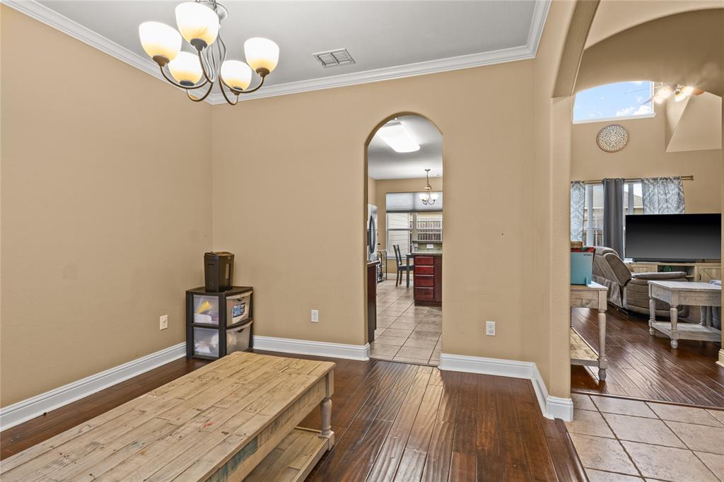 517 Austin Acre Road Sulphur Springs, TX 75482 - Photo 16 of 36 an empty room with wooden floor mirror and windows